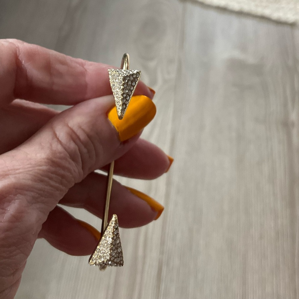 Neiman Marcus. Gold vermeil, open ended, band with crystal stones at points.